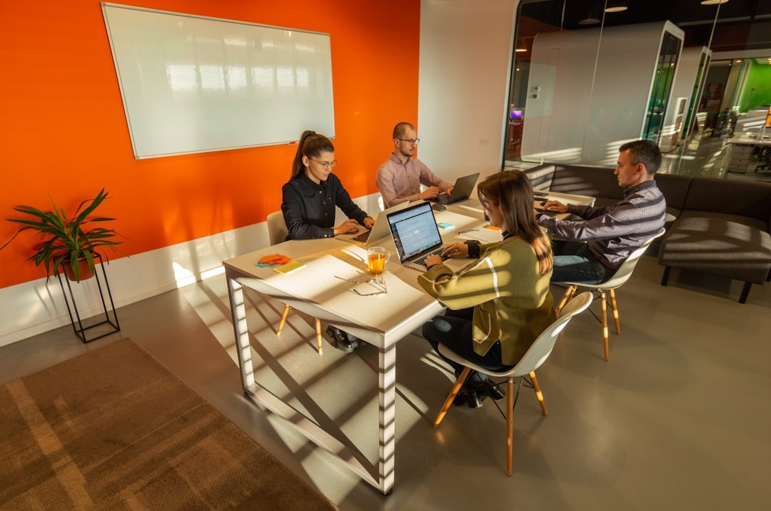 Team of media educators planning curriculum in a meeting room